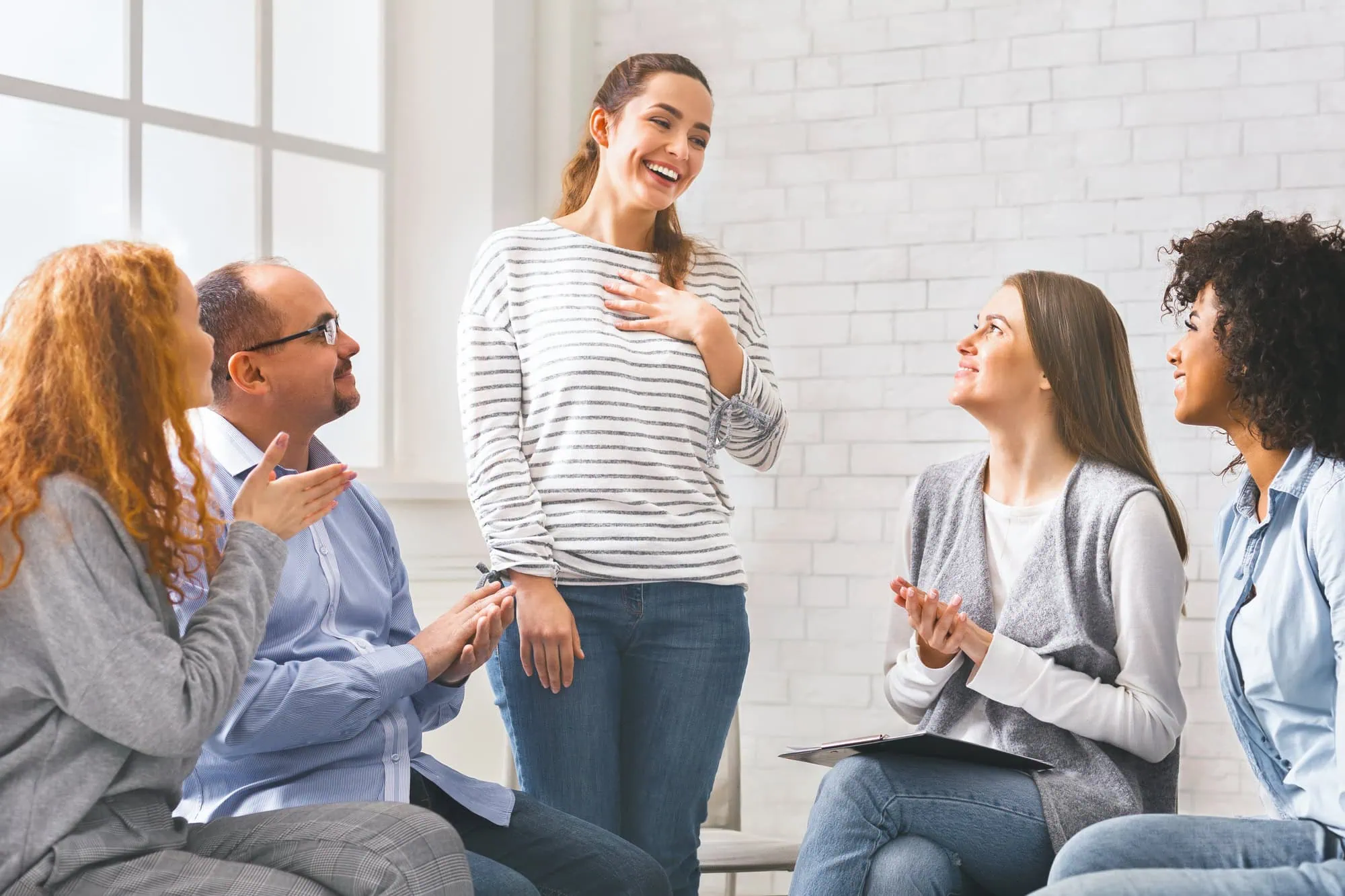 Woman talking relapse at a 12-step meeting